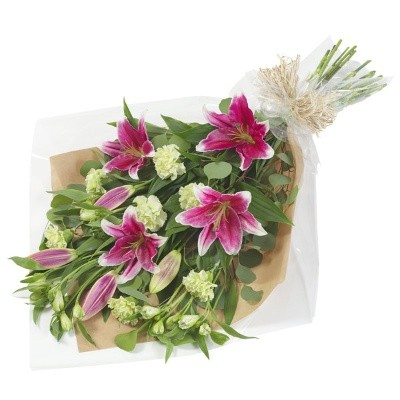 Pink and white seasonal flower bouquet with greenery and a ribbon bow.